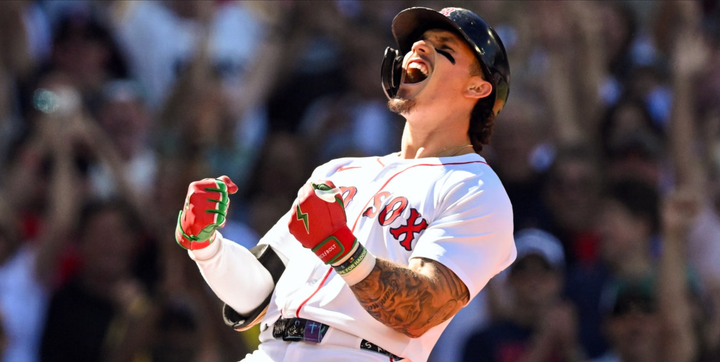 Jaren Duran clenching his fists and looking to the sky and yelling just after hitting an inside-the-park home run