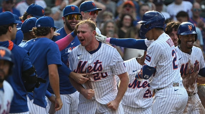 Pete Alonso mobbed at the plate after hitting a walkoff homer