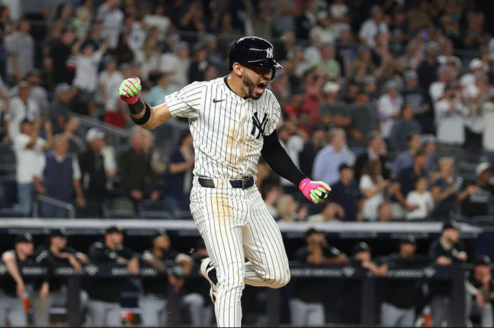 José Caballaro celebrating after hitting a walkoff single which clinched a playoff spot for the Yankees