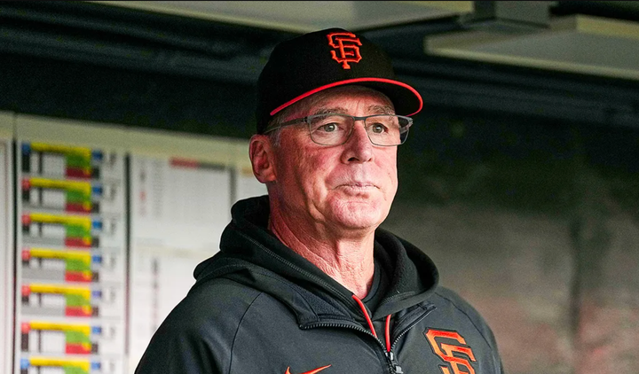 Bob Melvin in a Giants uniform looking out at the field 