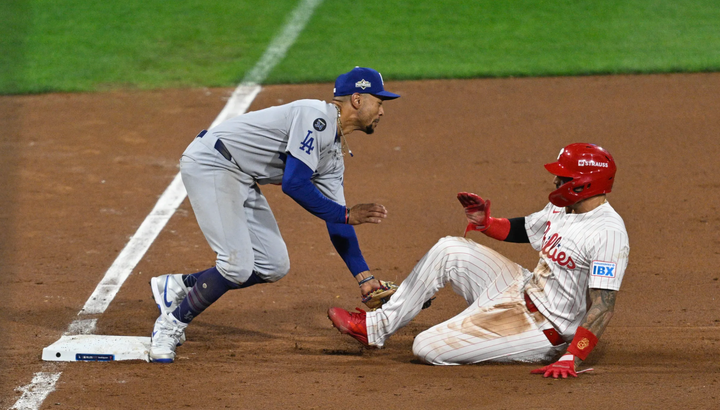 Mookie Betts tags out Nick Castellanos at third base following a bunt and a wheel play