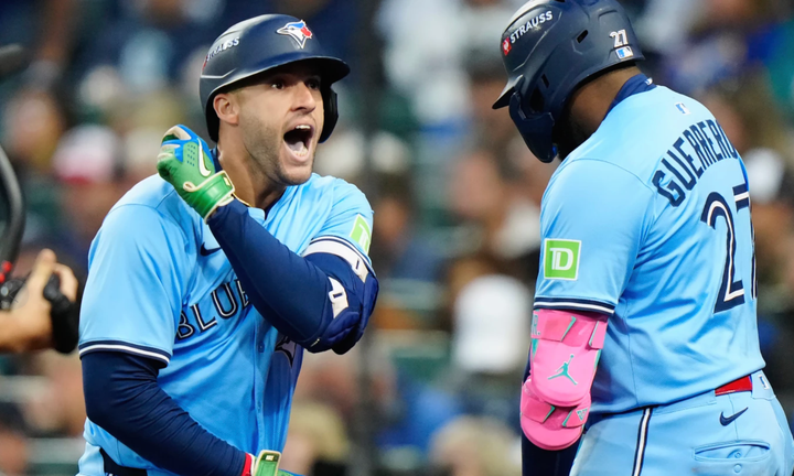 George Springer and Vlad Guerrero Jr. celebrating after the Blue Jays scored some runs