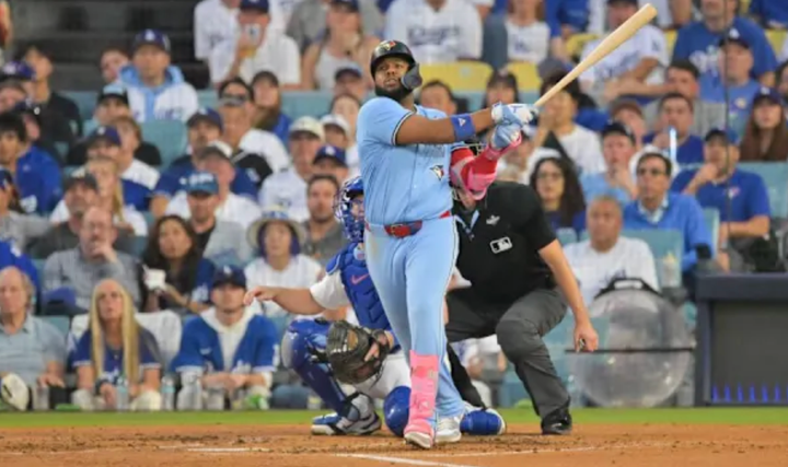 Vlad Guerrero Jr. hitting a home run in Game Four of the World Series. 