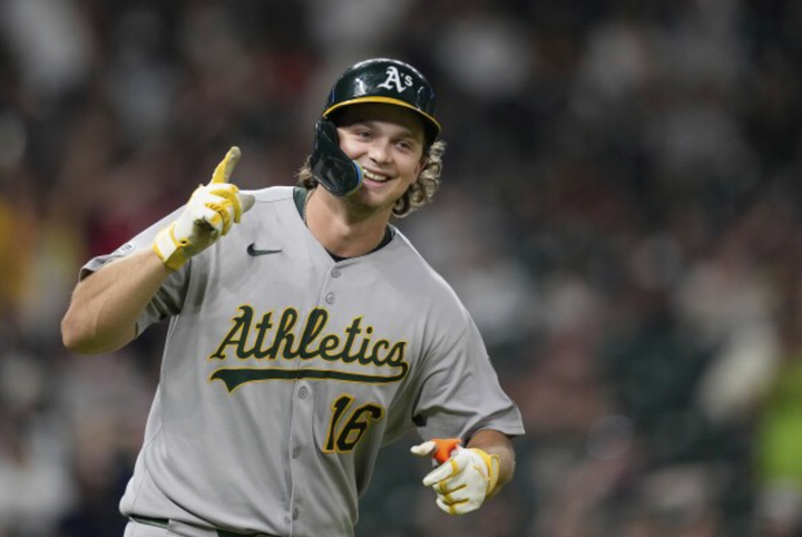 Nick Kurtz smiling and holding a finger up as he circles the bases after a homer