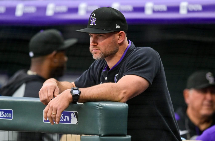 Manager Warren Schaeffer of the Rockies, looking out onto the field from the dugout