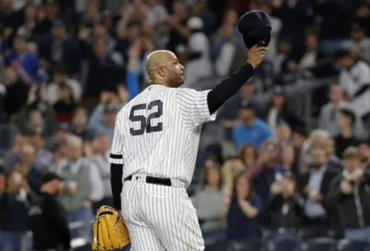CC Sabathia in Yankees uniform waving at the crowd