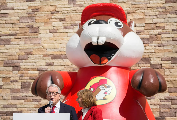 Ohio's governor and his wife in front of a giant inflatable Buc-ee's beaver