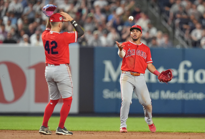 Zach Neto and Oswald Peraza letting a ball drop in