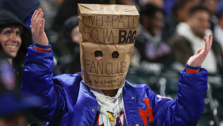A Mets fan with a paper bag over his head