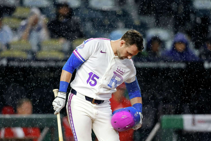 Lane Thomas bowing in the batter's box as it rains