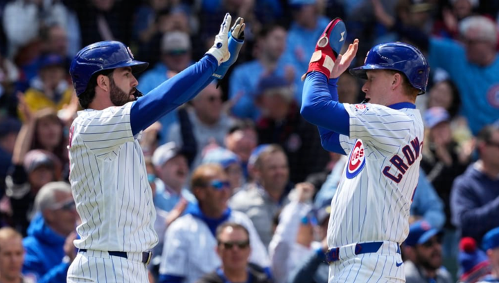 Two cubs players double high-fiving