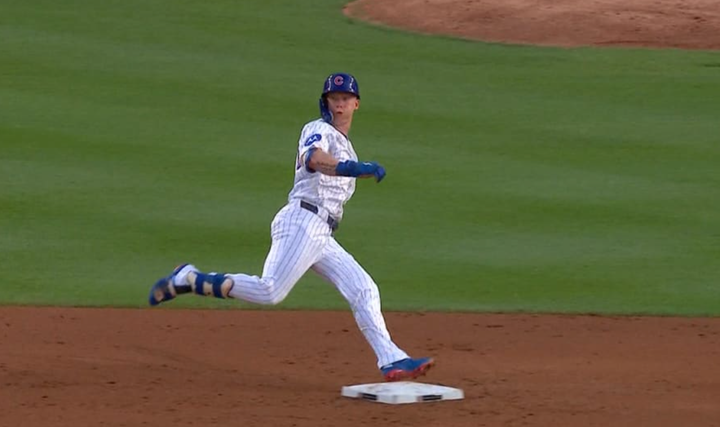 Pete Crow-Armstrong looks out to the outfield as he's rounding second base 