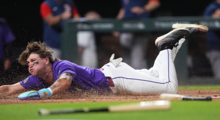 Jake McCarthy sliding on his belly