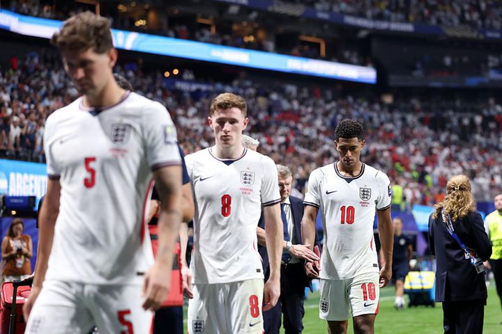 Dejected England players leaving the pitch