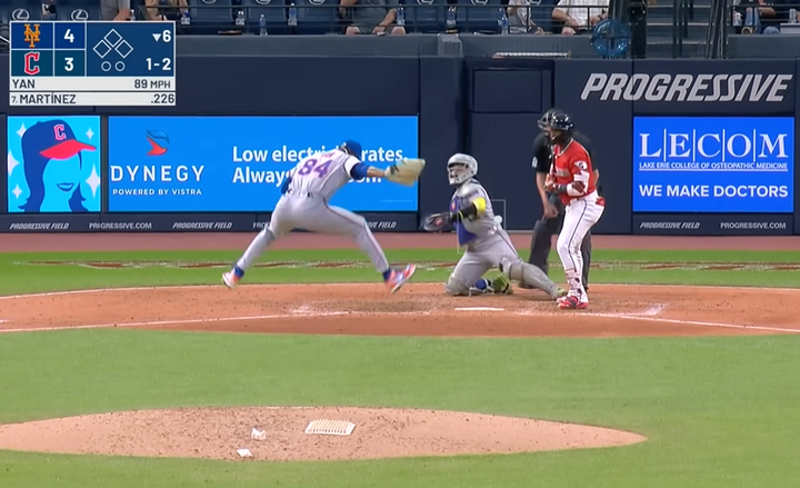 Jeffrey Yan jumping high after striking out a batter