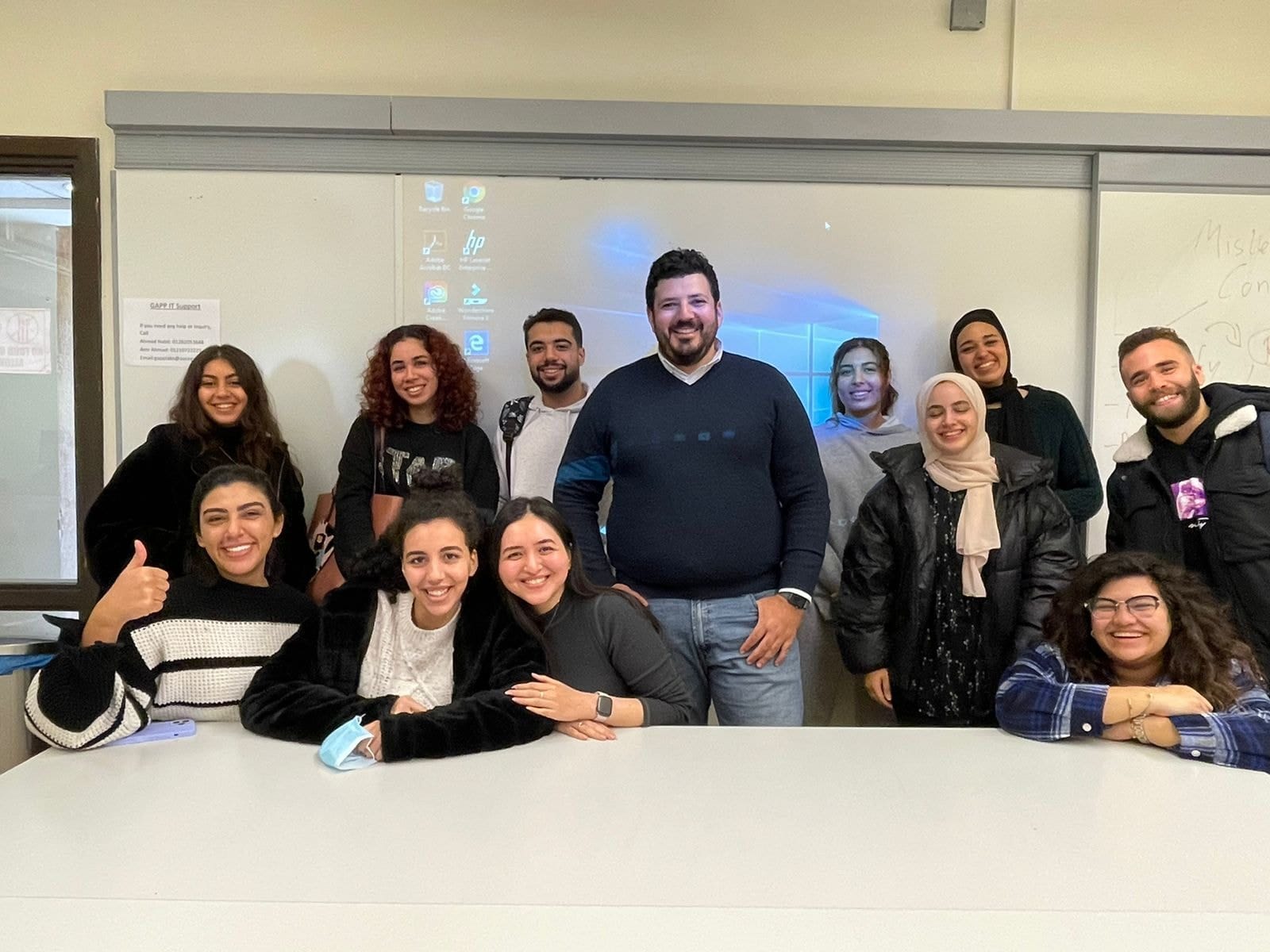 Eleraqi with his students.