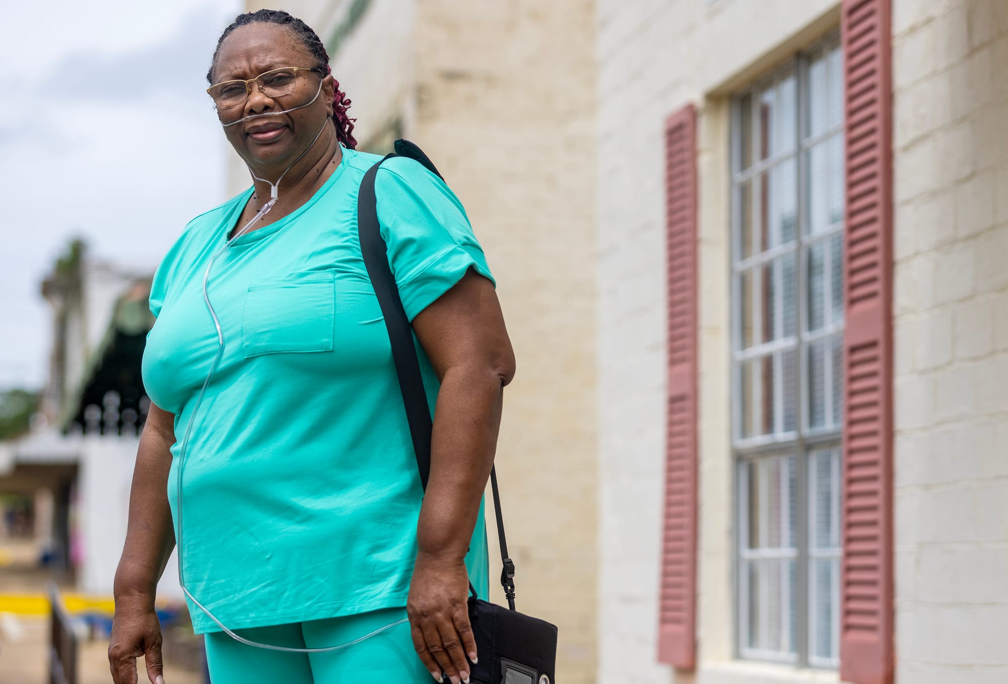 A woman with tubes in her nose.