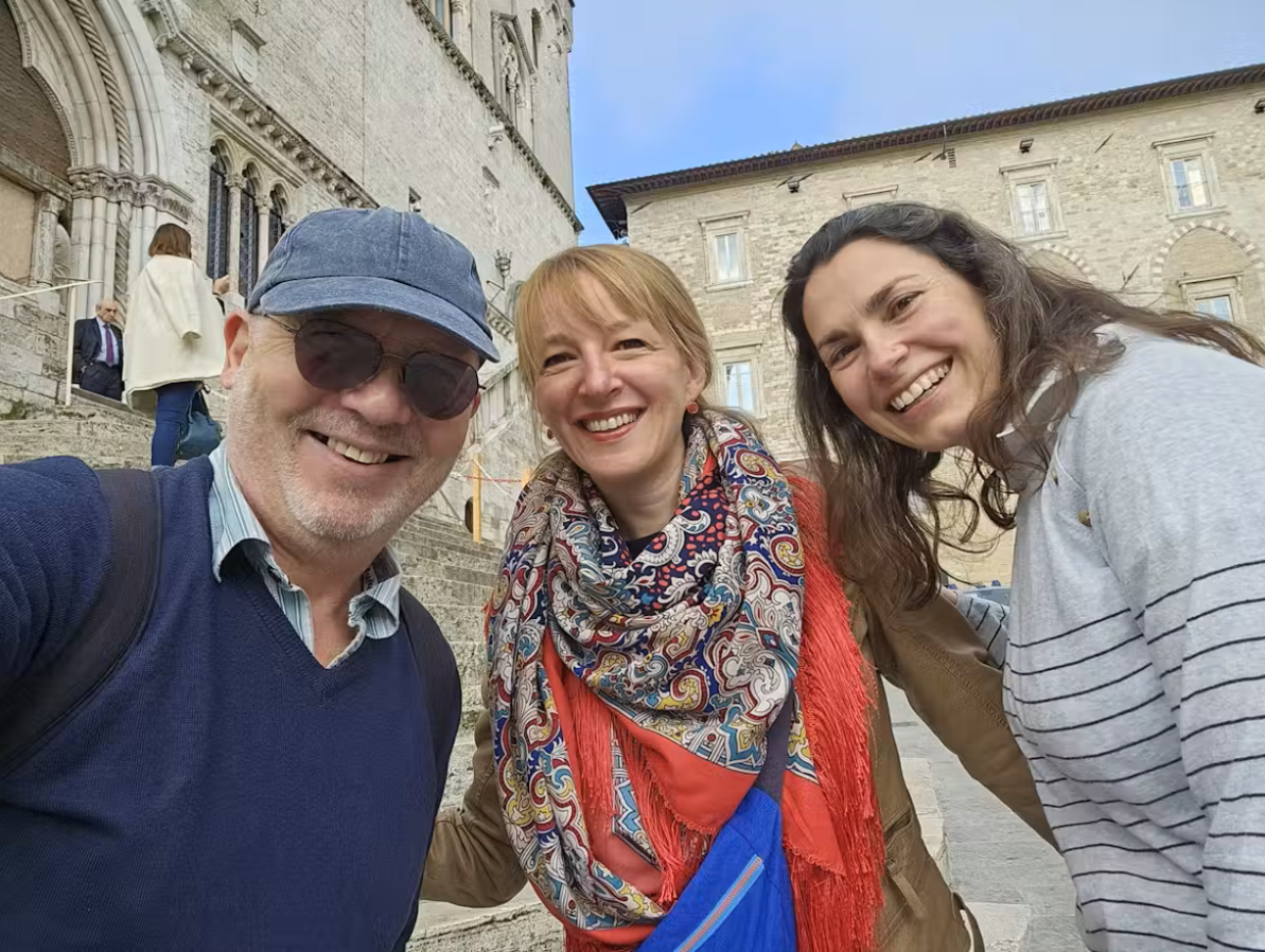 A man and two women taking a selfie