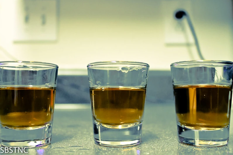 Shot glasses filled with alcohol.