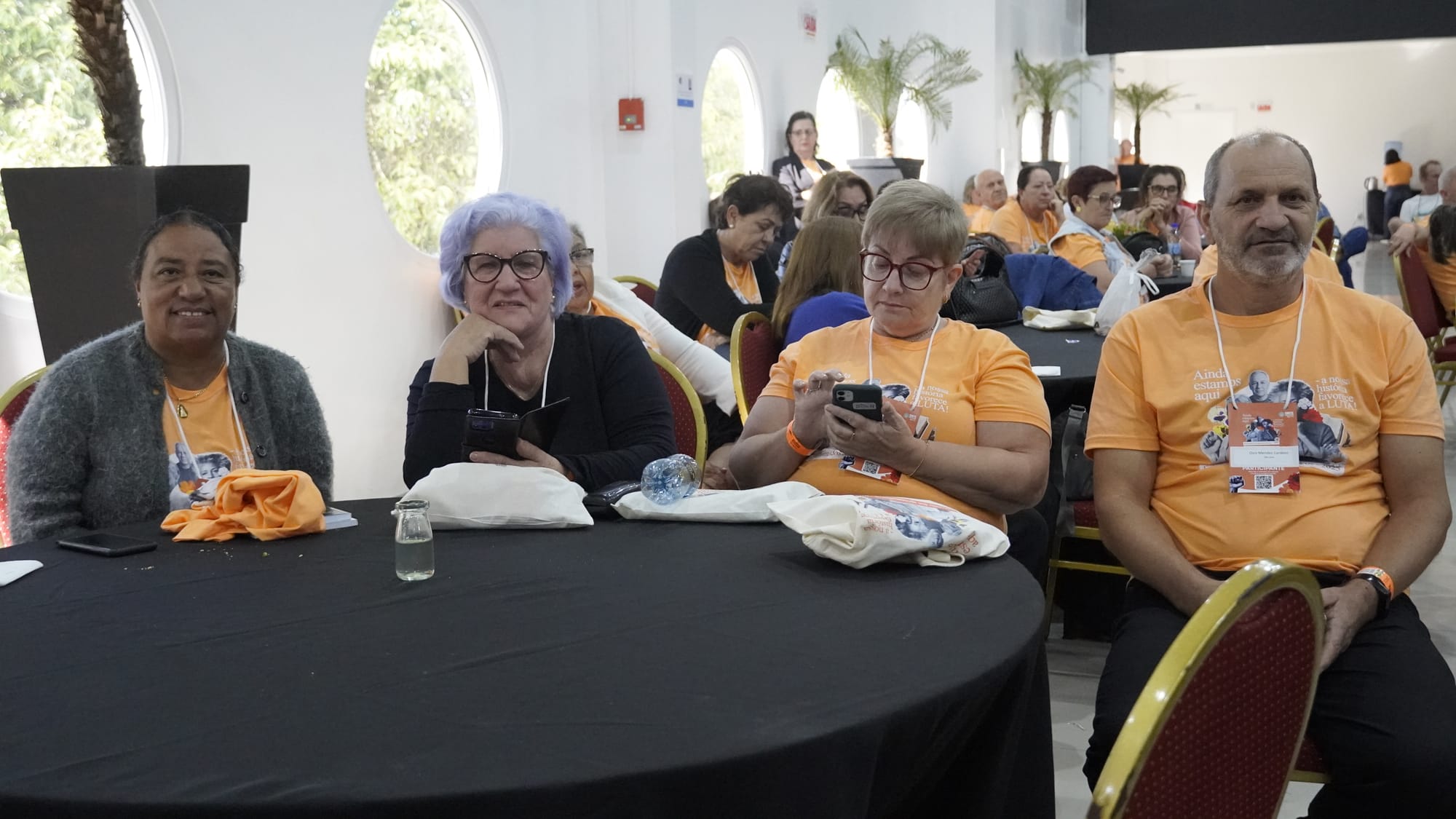 Four workshop attendees sitting at a table.