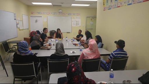 Mona Awwad listening to workshop attendees.