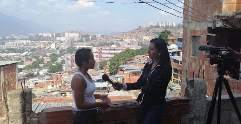 Ana interviewing a source. 