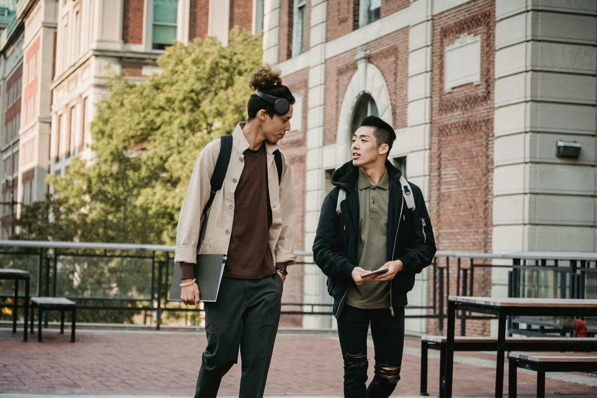 Two students walking and talking