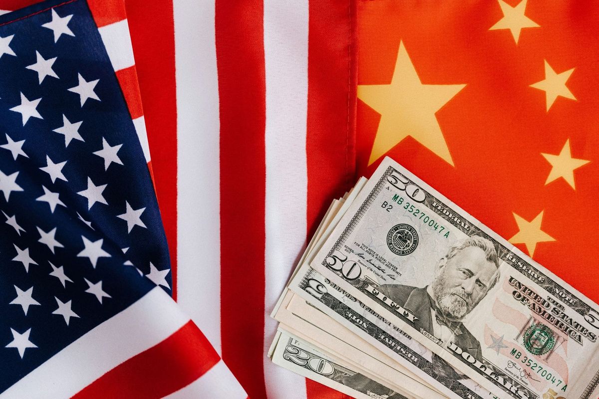 US, China flags and money