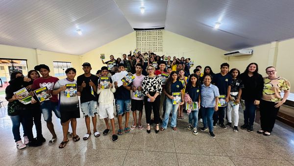 Josi posing with students. 