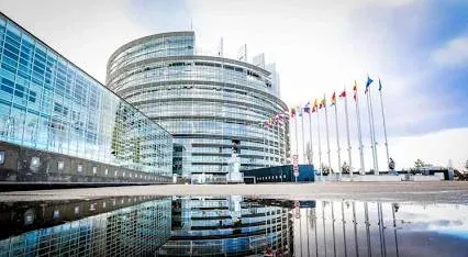 Modern glass facade and curved tower of the European Parliament Louise Weiss building in Strasbourg