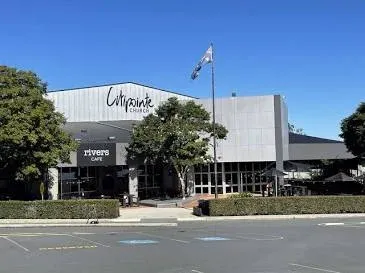 The exterior of Citipointe Church Brisbane, showing a large, modern worship center with an adjacent 'Christian Heritage College' building.