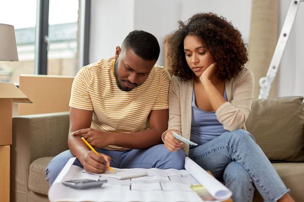 A couple checking their house documents