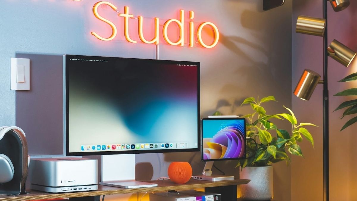 Mac Studio on Desk surrounded by Studio Display, HomePod mini, and more