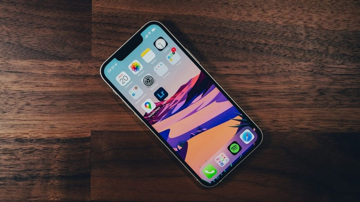 iPhone 13 mini on wooden table