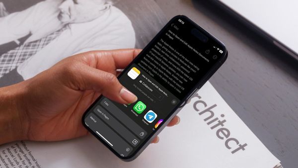 hand holding iPhone showing opening Notes as Pages documents