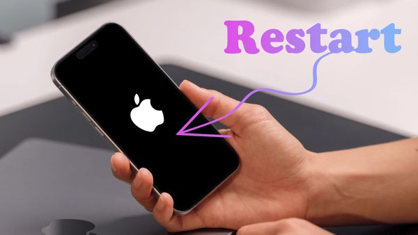 iPhone in hand showing apple logo on restart