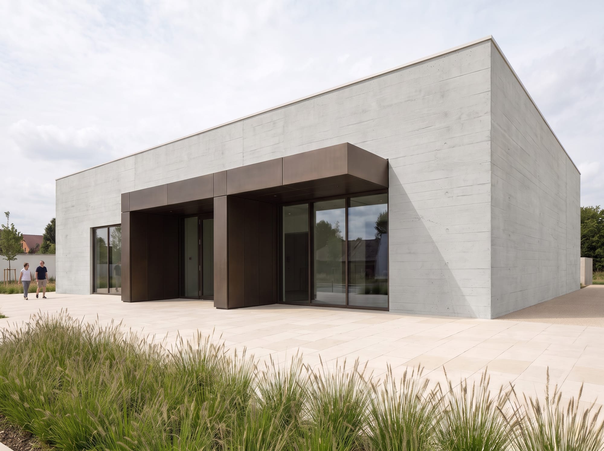 Architectural pavilion after a board-formed concrete facade edit.