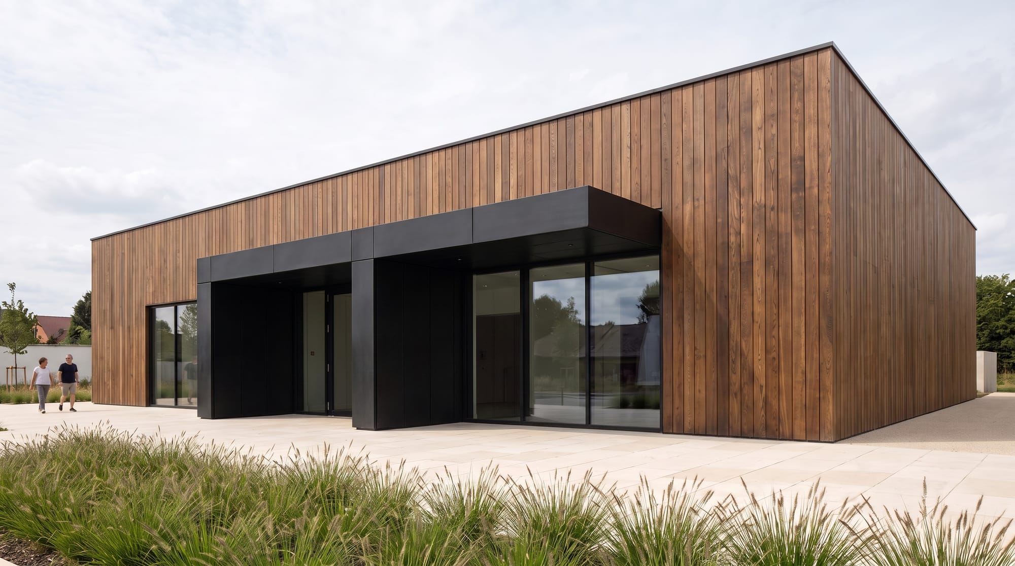 Cultural pavilion facade edited to vertical thermally modified timber with blackened-steel trim.