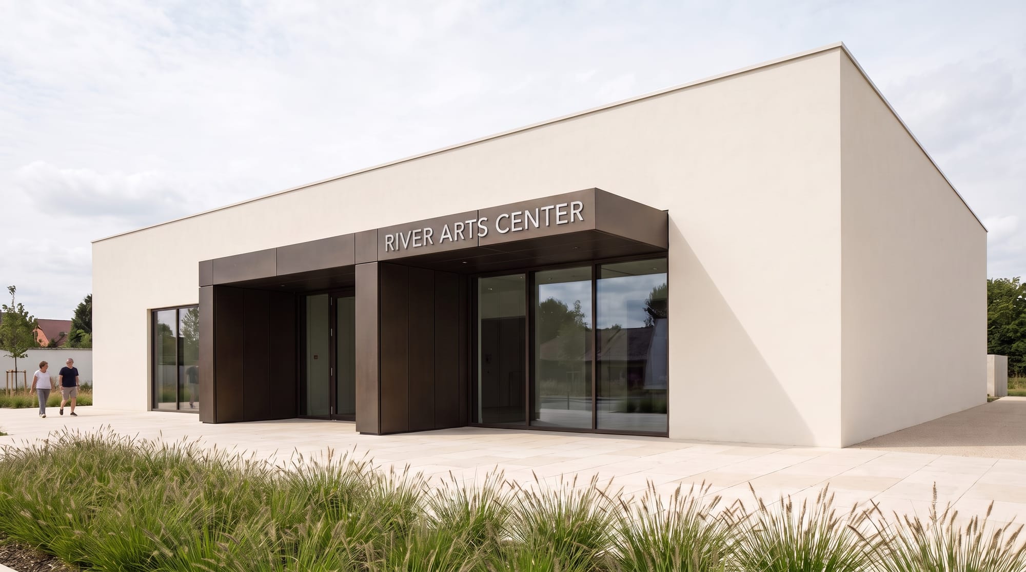 Contemporary pavilion with RIVER ARTS CENTER signage centered above the entrance.