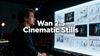 Director in a dark studio facing a glowing wall of cinematic storyboards, with bold central title text reading “Wan 2.5 Cinematic Stills” over the scene.