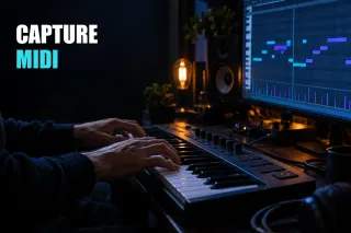 Hands on a MIDI keyboard and a piano roll on a monitor in a dark music studio