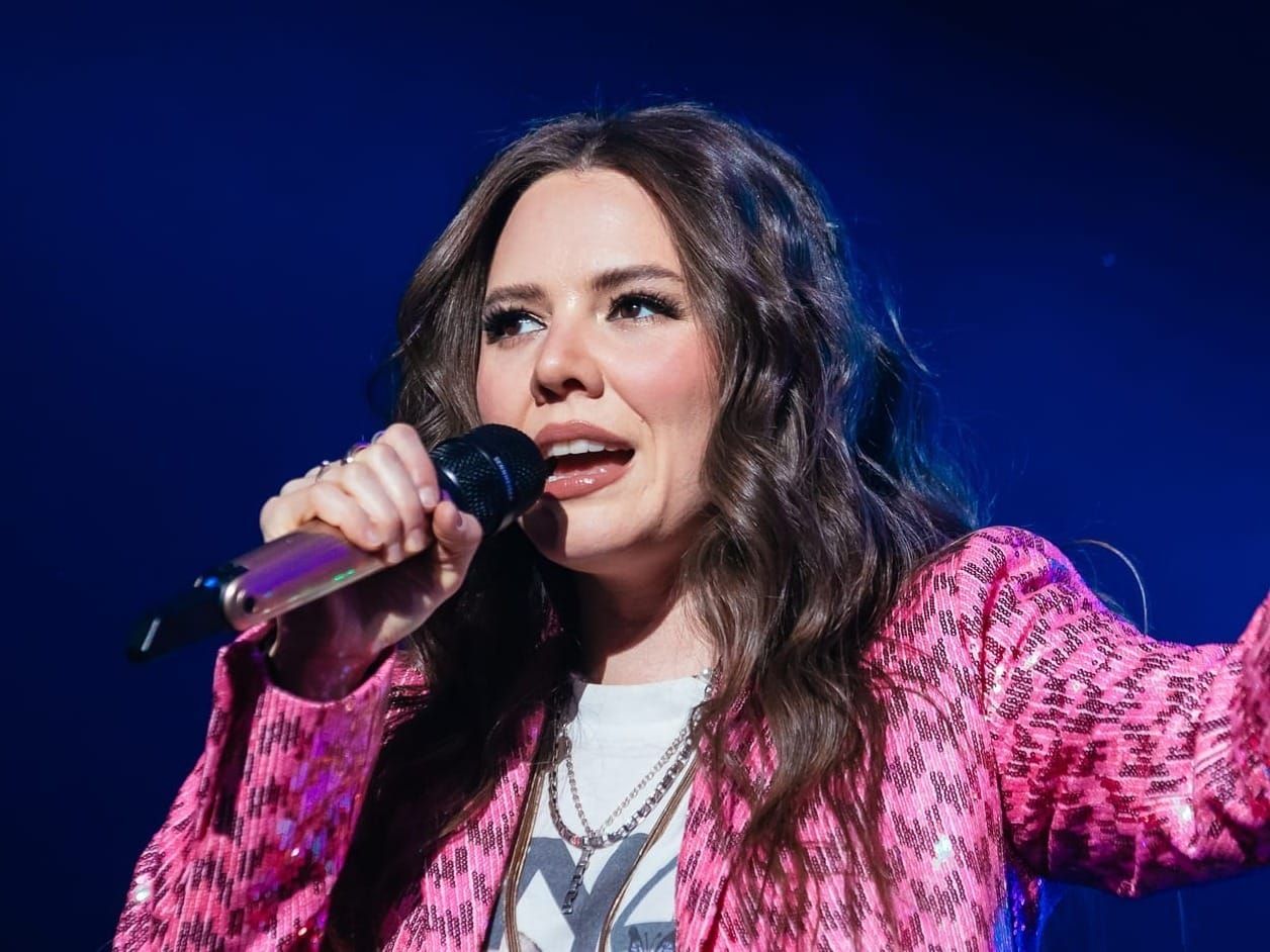 Joy Huerta, co-composer of ‘Real Women Have Curves,’ will offer pop-up acoustic concert