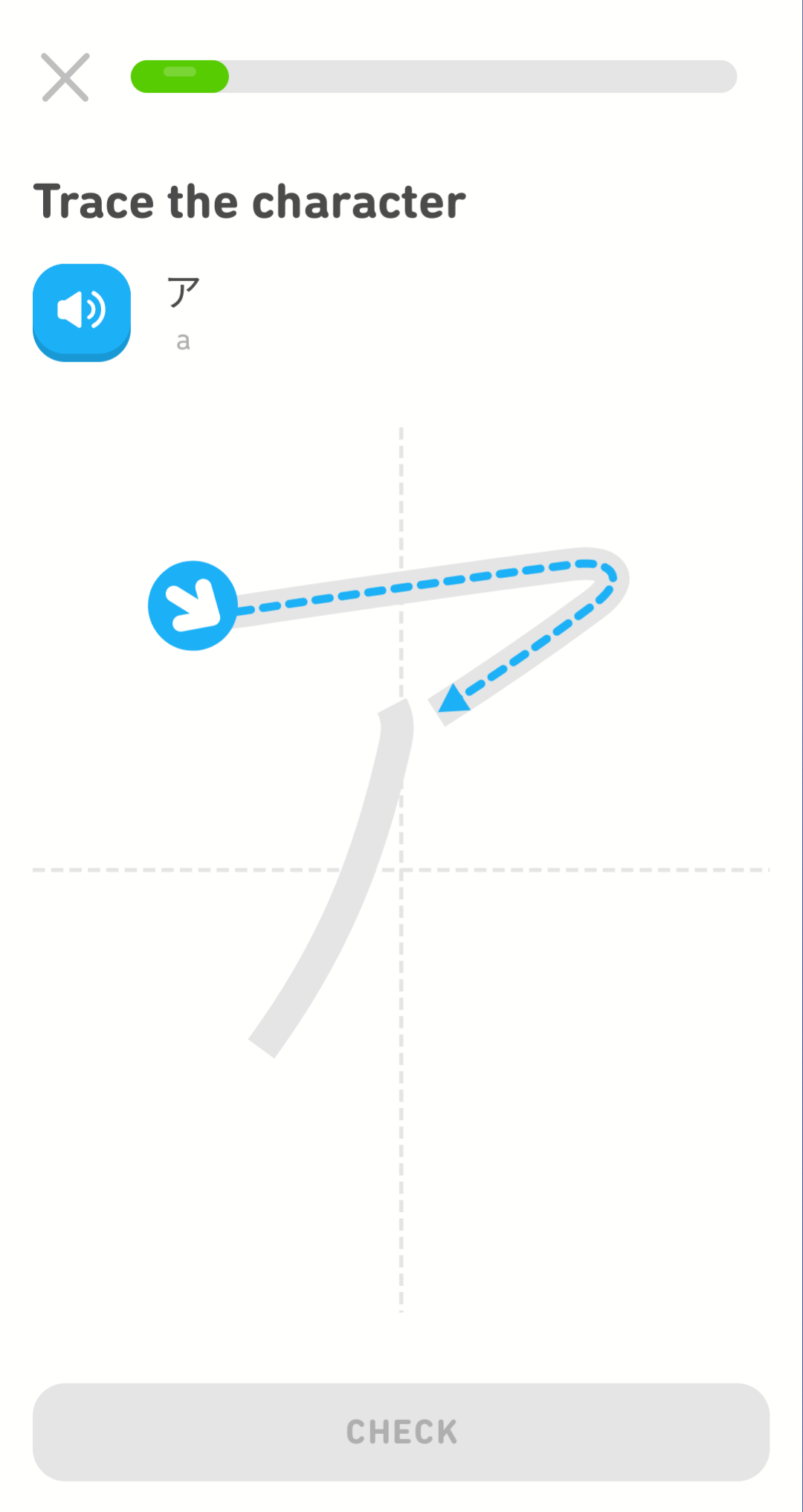 Screenshot of an exercise with the prompt "Trace the character" and below  the prompt is a blue audio button, next to it a small Japanese character, and below the character the Latin script letter representing the sound "a". In the center of the screen is a large space with a faint, gray graph of the center vertical and horizontal axes. There is a light gray shap on the space that is the same as the character above. There is a blue arrow indicating where to start tracing and a dotted blue line indicating which part of the characte to trace first.