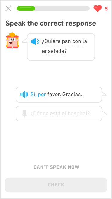 Screenshot of an immersion exercise in the Spanish course for English speakers. The instructions say "Speak the correct response" and below is Eddy's head speaking a line of Spanish dialogue. Eddy has chin-length blonde hair held back by a red headband that matches his red tracksuit. His line of dialgue is in a speech bubble, and below are two response speech bubbles for the learner to choose for an answer.