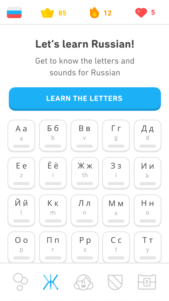 Screenshot of the Russian course reading tab. The text at the top says "Let's learn Russian! Get to know the letters and sounds for Russian." Below the text is a blue button that reads "Learn the letters" and below that a 4 by 4 chart of white tiles for the different Russian letters. Each tile has the Russian letter in upper case and lower case, and below it a small letter from the English alphabet representing the sound.