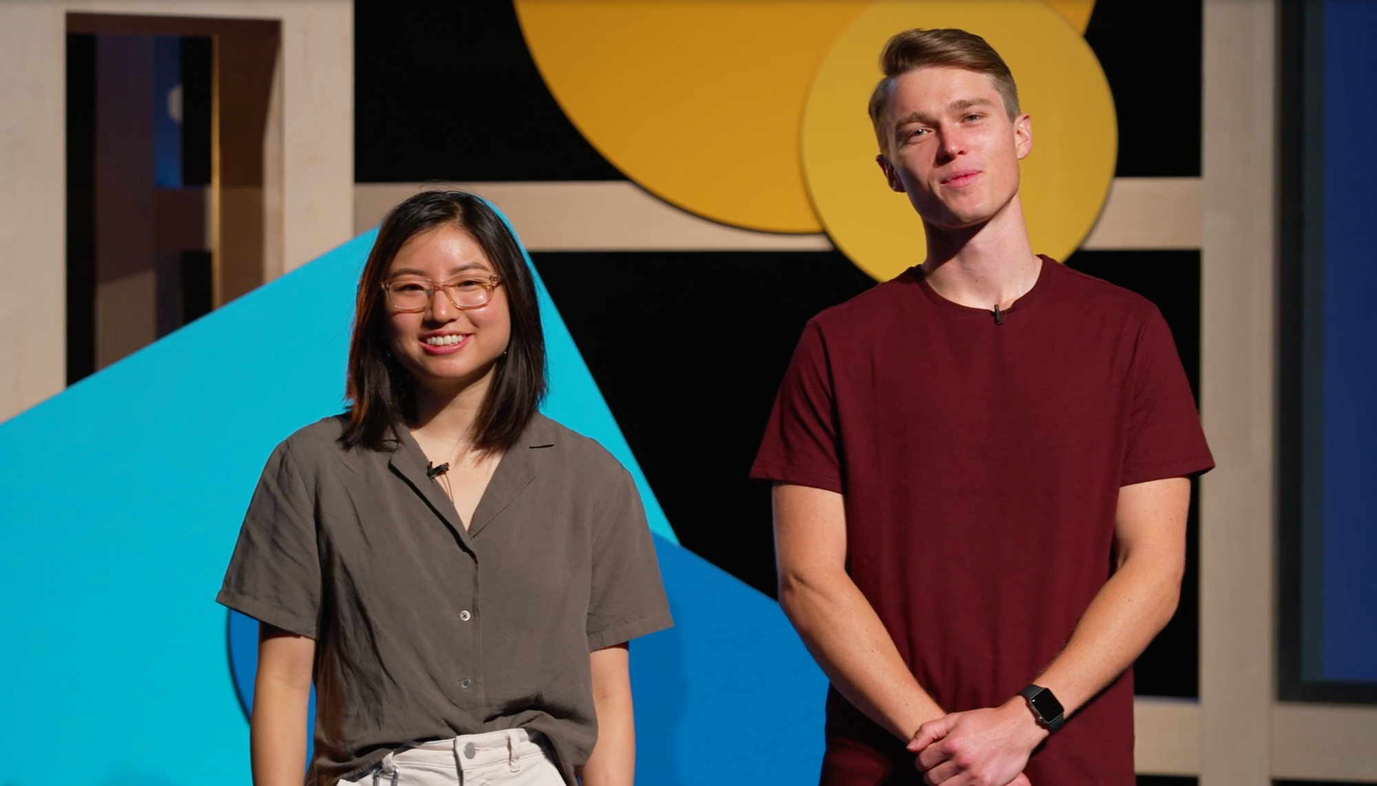 photograph of Angela and Edwin standing on stage