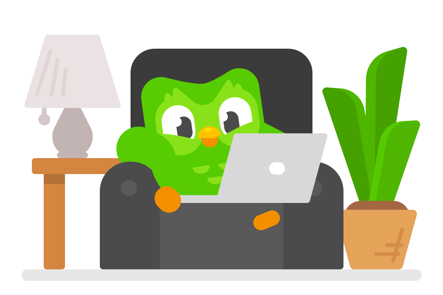 Duo sitting in an armchair on a laptop computer