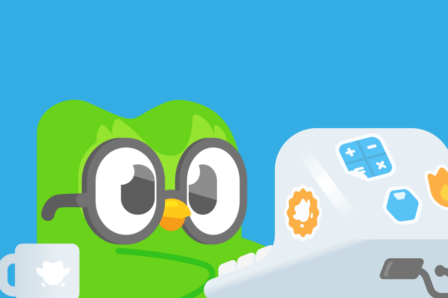 Illustration of Duo hard at work on a computer sitting next to a cup of coffee