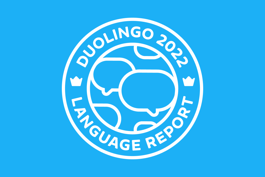 The phrase "2022 Duolingo Language Report" in a circle around a globe with speech bubbles instead of continents