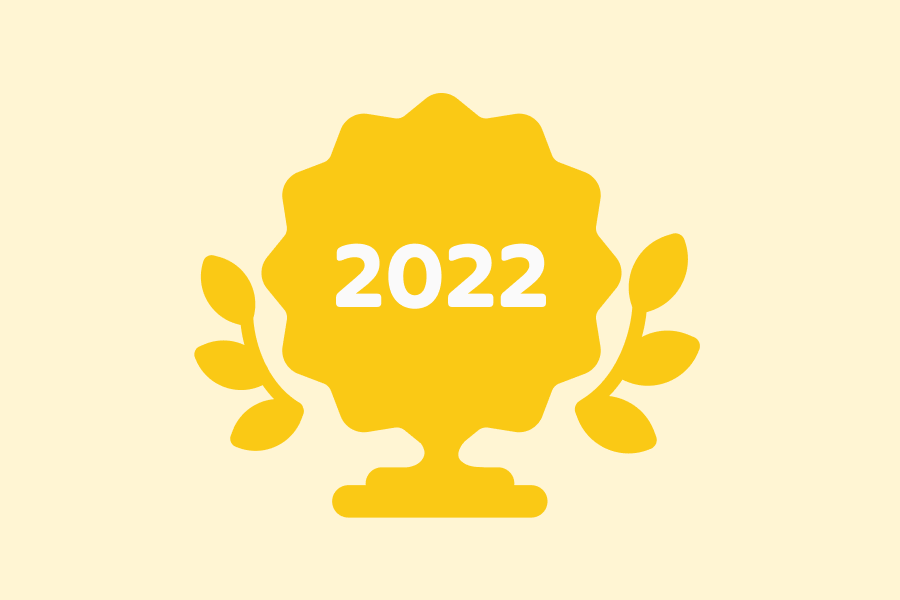 Illustration of a trophy in the shape of the Duolingo English Test logo, labeled with 2022